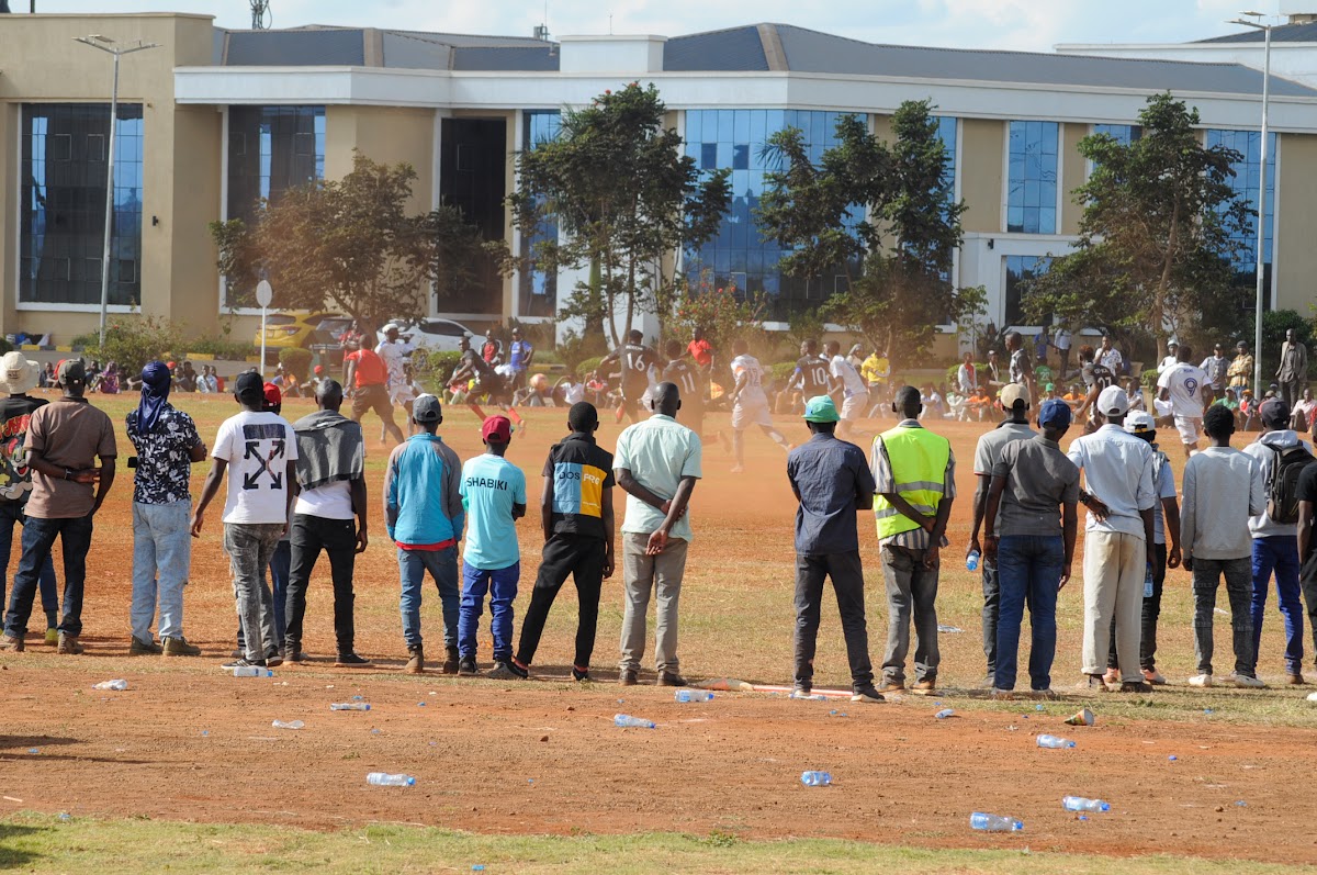 Community members gathering together at a football event